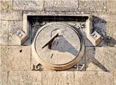  ??  ?? Shining example: a sundial on a building in the high street of Chipping Campden