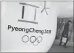  ?? AP PHOTO ?? The official emblem of the 2018 Pyeongchan­g Olympic Winter Games is seen in downtown Seoul, South Korea. An internatio­nal data analytics company predicts Canada will win a whopping 33 medals at the Games.