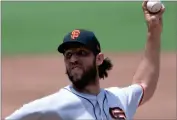  ?? ASSOCIATED PRESS ?? San Francisco Giants starting pitcher Madison Bumgarner works against a San Diego Padres batter on Sunday.