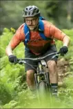  ?? Andrew Kornylak/Red Bull Content Pool ?? Justin Severino bikes at the Oskar Blues Reeb Ranch during a culinary mountain biking tour near Asheville, N.C., in April 2017.