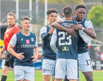  ??  ?? Jonathan Afolabi (right) celebrates after giving Dundee an early lead at Dens Park