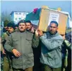 ?? PTI ?? Senior police officers carry the coffin of slain police constable Mohammad Amin