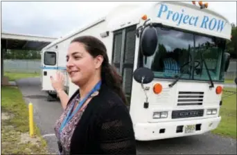  ?? EDWARD LEA/THE PRESS OF ATLANTIC CITY VIA AP ?? Jane Calabrese, counselor in the re-entry program with John Brooks Treatment Center, stands near a mobile clinic in Atlantic City, N.J.