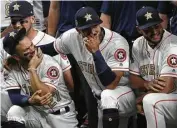  ?? Karen Warren / Houston Chronicle ?? Jose Altuve and Carlos Correa show off their World Series rings with fellow players before the start of Tuesday’s game at Minute Maid Park.