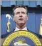  ?? Rich Pedroncell­i AP ?? “RELEASE your tax returns as you promised,” Gov. Gavin Newsom told the president.