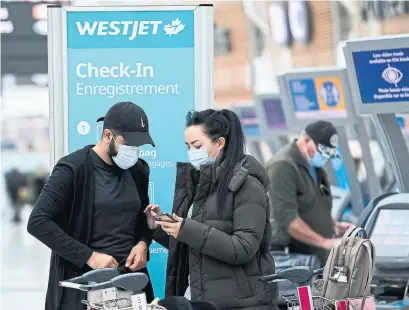  ?? NATHAN DENETTE THE CANADIAN PRESS FILE PHOTO ?? WestJet said it had to deny boarding to 32 passengers on its six internatio­nal flights into Canada on Thursday.