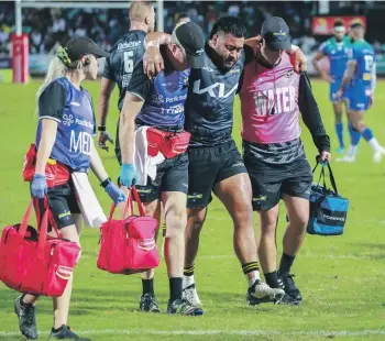  ?? GETTY IMAGES ?? Hurricanes vice captain Asafo Aumua is helped from the field after suffering an injury against Fijian Drua.