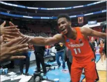  ?? PAUL SANCYA — THE ASSOCIATED PRESS ?? Syracuse forward Oshae Brissett (11) celebrates after defeating Michigan State in an NCAA men’s college basketball tournament second-round game in Detroit, Sunday.