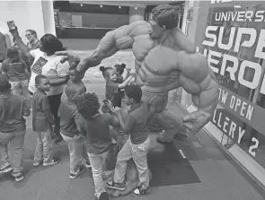  ?? FRED SQUILLANTE/COLUMBUS DISPATCH ?? Kids of all ages gather near the “Marvel Universe of Super Heroes” exhibit at COSI.