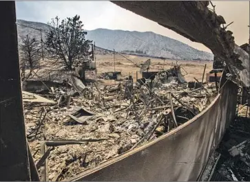  ?? Allen J. Schaben Los Angeles Times ?? THE BOBCAT FIRE burned this home in Juniper Hills in the Angeles National Forest in September. Insurers are now banned for a year from canceling or refusing to renew homeowners policies in nearby ZIP Codes.