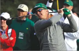  ?? The Associated Press ?? Charley Hoffman hits a drive on the 18th hole during the first round of the Masters golf tournament Thursday in Augusta, Ga. Hoffman leads after firing a 7-under 65.