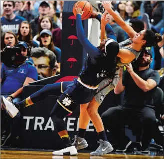  ?? SEAN D. ELLIOT/THE DAY ?? UConn’s Kia Nurse fouls Notre Dame’s Arike Ogunbowale fighting for the ball during Sunday’s game at the XL Center in Hartford. No. 1 UConn beat No. 3 Notre Dame, 80-71.