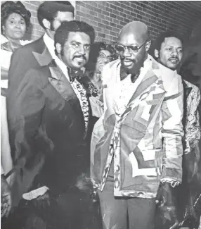  ?? NEWMAN COURTESY OF FLOYD ?? In this undated Ernest Withers image, saxophonis­t Floyd Newman (left) stands beside friend Isaac Hayes during a Kappa Ball at Club Paradise.