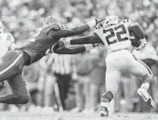  ?? BRONTE WITTPENN/TAMPA BAY TIMES ?? Florida defensive lineman Jabari Zuniga (92) tackles LSU running back Clyde Edwards-Helaire (22) in the second quarter Saturday in Gainesvill­e.