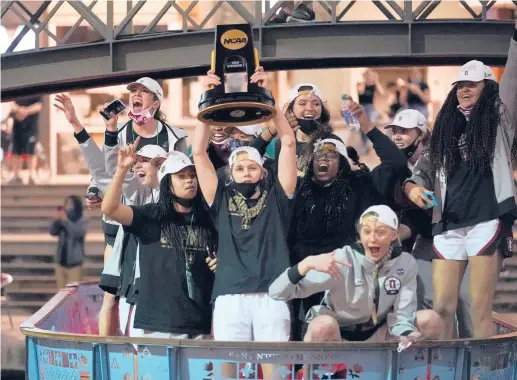  ?? ERIC GAY/AP ?? Stanford players celebrate their national championsh­ip Sunday night on the River Walk in San Antonio. It’s the program’s third title.