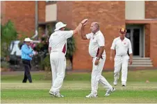  ??  ?? Sunshine Coast player Gary Davis (left) celebrates catching John Milton of Toowoomba Grey Cavaliers off ball delivered by Phil Drescher (right).