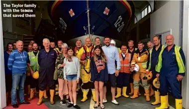  ??  ?? The Taylor family with the teams that saved them