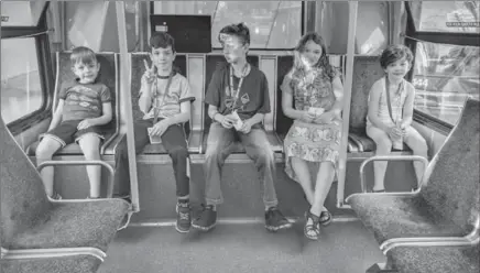  ?? ADRIAN CROOK PHOTO ?? Adrian Crook’s children, ages 7 to 11, ride a bus in Vancouver. British Columbia’s Children’s Ministry has forbidden him to allow his children to travel by public transit without an adult.