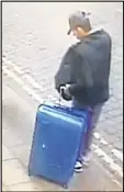  ??  ?? Salman Abedi is shown carrying a distinctiv­e blue suitcase in an image released by police.