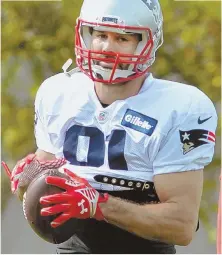  ?? STAFF PHOTO BY CHRIS CHRISTO ?? GETTING HIS REPS: New Patriots receiver Eric Decker runs a drill yesterday in Foxboro.