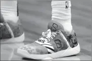  ?? AP ?? The sneakers Spencer Dinwiddie of the Brooklyn Nets wore in tribute to his childhood idol Dwyane Wade of the Miami Heat during their NBA showdown on Tuesday in Miami.