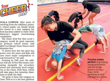  ??  ?? Practice makes perfect: Ong helping young participan­ts with the bridge position during a Cheer 2018 workshop at Quill City Mall last month.