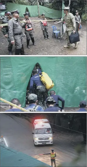  ??  ?? AT THE SCENE: Emergency services and rescue personnel near a cave where 12 boys and their football coach have been trapped since June 23, in Mae Sai, Chiang Rai province, northern Thailand yesterday.