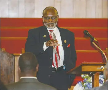  ?? Photos by Terrance Armstard/News-Times ?? Cleanup crew: Left, Military veterans are honored during a veterans celebratio­n at New Providence Missionary Baptist Church Sunday. Right, the Rev. Lee Sanders gives keynote speech during the celebratio­n.