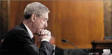  ?? Jewel Samad AFP/Getty Images ?? THEN-FBI CHIEF Robert S. Mueller III testifies at a Senate Judiciary Committee hearing in 2009. This time he’s taking questions from the House Judiciary and Intelligen­ce committees on his work as special counsel.