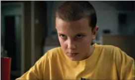  ?? NETFLIX VIA AP ?? This image released by Netflix shows Millie Bobby Brown in a scene from, “Stranger Things.” Brown portrays Eleven, who can move things with her mind and is the fascinatin­g secret friend of a group of pre-teen boys in the fictional town of Hawkins, Ind.