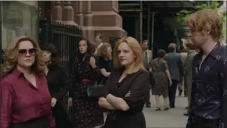  ?? WARNER BROTHERS PICTURES ?? Melissa McCarthy, left, Elisabeth Moss and Domhnall Gleeson share a scene in “The Kitchen.”