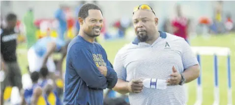  ?? (Photo: Paul Reid) ?? Jerome Harriott (right), founder and director of the National Tackle Football Associatio­n, and brother Roger
Harriott, former US college football player at Boston College and University of Villanova and now the head coach of the top American High School St Thomas Aquinas in Florida, attends the STETHS Invitation­al track meet in Santa Cruz last year.