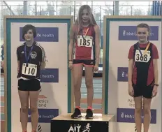  ??  ?? Bronzemeda­list in the under-13 girls long jump, Valerie Doogue (left), at the Leinster Indoor Athletics at Athlone IT.