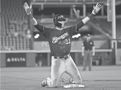  ?? GETTY IMAGES ?? Christian Yelich celebrates after hitting a triple for his first cycle for the Brewers against the Reds in 2018.