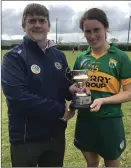  ??  ?? Munster Junior Camogie Final captain Aoife Behan with chairman of Munster Camogie John Foley