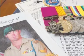  ?? Picture: RICHARD GOSLING ?? A list of aspiration­al mottos written by Corporal Cameron Baird is among a collection of memorabili­a held by the Victoria Cross recipient’s family.