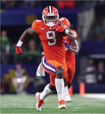  ?? AP FILe ?? THE ROAD AHEAD: Travis Etienne and Clemson can book another trip to the College Football Playoff with a win over Notre Dame today.