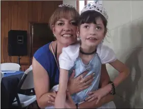  ?? PHOTO ANDY VELEZ ?? Nora Cornejo with were 8-year-old daughter, Lexy, Tuesday at the first Royal Blue Ball at Kingdom Hall in El Centro. The event was organized by Autism Support of Imperial County.