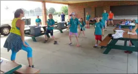  ?? ZACHARY SRNIS — THE MORNING JOURNAL ?? Children at Camp Good Grief participat­e in a zumba exercise.