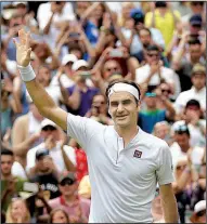  ?? AP/TIM IRELAND ?? Roger Federer defeated Adrian Mannarino in three sets Monday in the fourth round at Wimbledon. Federer is attempting to win his ninth Wimbledon championsh­ip.