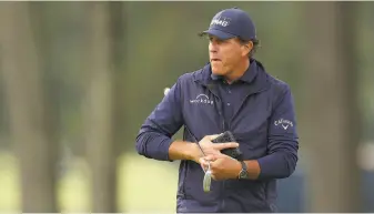  ?? Gregory Shamus / Getty Images ?? Phil Mickelson is preparing to try for a fourth Masters title by playing against older pros in Virginia. At 50, Mickelson says he still hits long enough but straight enough is another matter.