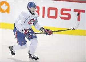  ?? $1 1)050 ?? Montreal Canadiens’ Alex Galchenyuk goes after a flying puck during a practice on April 10 in Brossard, Que.