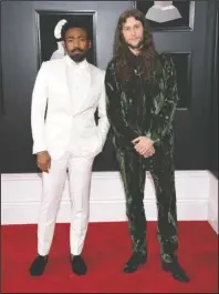  ?? The Associated Press ?? COMPOSER: Childish Gambino, left, and composer Ludwig Goransson arrive at the 60th annual Grammy Awards on Jan. 28 in New York. At just 34, Goransson is having the best year of his career. He completed the film score for the uber-successful “Black Panther,” and earned three nomination­s at this year’s Grammy Awards. He also composed music for the film “Venom,” released last month, and returned to the “Creed” franchise to do its film score.