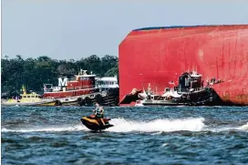  ?? GETTY IMAGES ?? The ship carrying 24 crew members and 4,200 vehicles capsized Sept. 8. After the vessel rolled over on its left side, a fire broke out. All crew members were rescued, including four who were trapped in the boat until the following day.