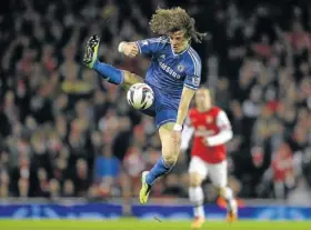  ?? PHOTO: TOBY MELVILLE/REUTERS ?? COMFORTABL­E: Chelsea’s David Luiz controls the ball during their English League Cup fourth round match against Arsenal at Emirates Stadium in London on Tuesday night