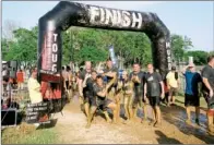  ?? PHOTO COURTESY OF PRISCILLA FORTE ?? The Tough Mudder obstacle course is both a physical and mental challenge built around the team concept, which builds camaraderi­e among participan­ts.