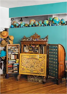  ?? ?? Her Storage Chest
“This is my Wooton desk,” Dorothy says of the late-19th-century piece. It holds her rubber-stamp collection, albums, small stationery, and more.