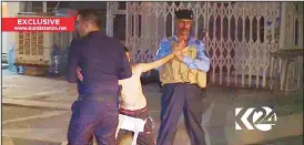  ??  ?? In this still taken from local TV footage, showing a child being restrained by security forces, holding his arms out-stretched as another cuts off a belt of explosives, on Aug 21, in Kirkuk, Iraq. Iraqi police say they have apprehende­d a boy...