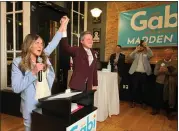  ?? TANIA BARRICKLO/DAILY FREEMAN ?? Gabriella ‘Gabi’ Madden and state Sen. James Skoufis, her former boss, raise their hands at an event at Savona’s Trattoria & Bar in Downtown Kingston, N.Y., launching her campaign for the Democratic nod in the 103rd Assembly District currently occupied by Assemblywo­man Sarahana Shrestha, D-Esopus. Kingston Mayor Steve Noble is to the right of Skoufis.