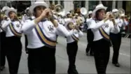  ?? AP PHOTO/SETH WENIG, FILE ?? In this Oct. 13, 2014, file photo, a marching band participat­es in the Columbus Day parade in New York. A movement to abolish Columbus Day and replace it with Indigenous Peoples Day has new momentum but the gesture to recognize victims of European colonialis­m has also prompted howls of outrage from some Italian Americans, who say eliminatin­g their festival of ethnic pride is culturally insensitiv­e, too.